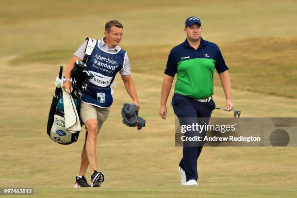 Duncan Stewart of Scotland walks with his caddy on hole four during day two of the Aberdeen Standard Investments Scottish Open at Gullane Golf Course...