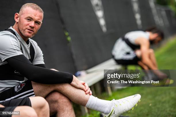 United's forward Wayne Rooney speaks to one of his teammates ahead of practice at RFK Stadium training grounds on Friday, July 6 in Washington, D.C.