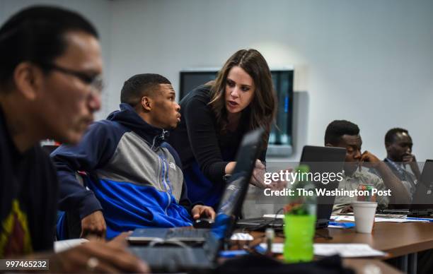 Isaiah Hall listens intently to the job training instructions of career skills coach Jana Dye on the first day of a weeklong job training class at...