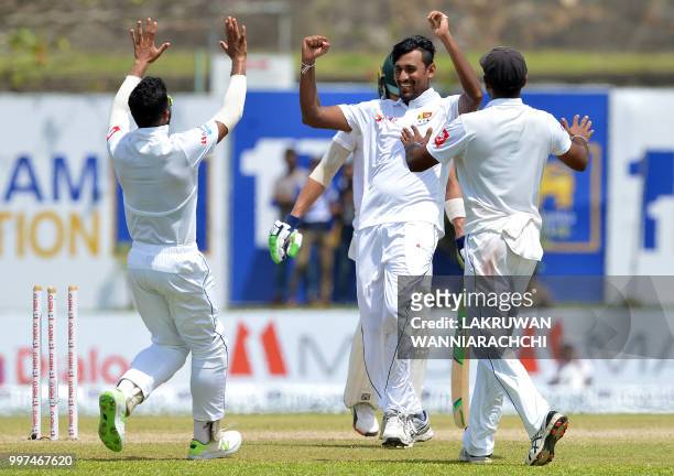 Sri Lanka's Suranga Lakmal celebrates with his teammates after he dismissed South Africa's captain Faf du Plessis during the second day of the...