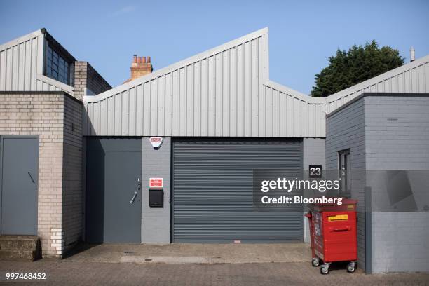 Closed shutters sit on office spaces at the Zennor Tradepark trading estate in the Balham district of south London, U.K., on Friday, Jun. 29, 2018....