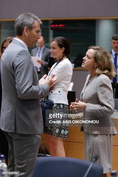 Austria Finance Minister Hartwig Loeger and Spanish Economy Minister Nadia Calvino talk during an Ecofin Finance Ministers meeting in Brussels,...