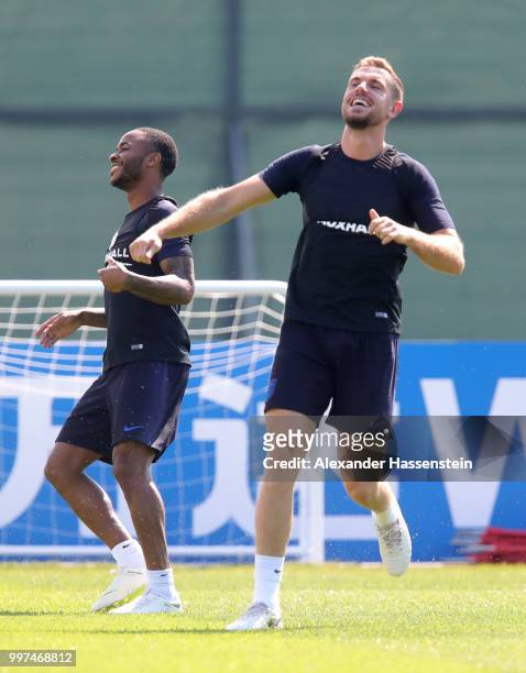 Raheem Sterling and Jordan Henderson of England take part in a drill during an England training session during the 2018 FIFA World Cup Russia at...