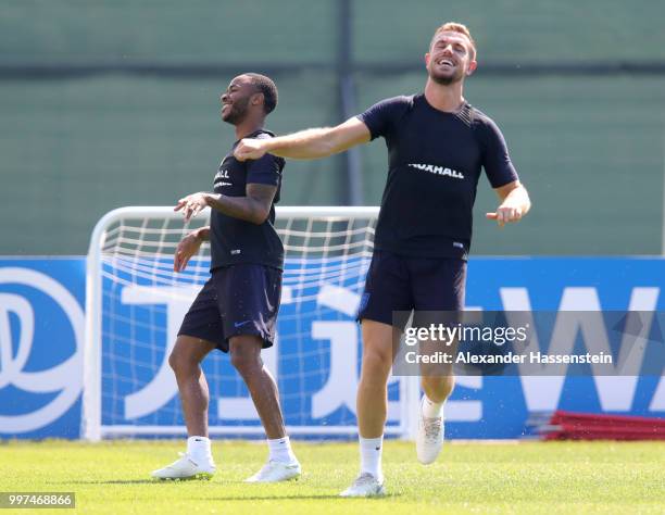 Raheem Sterling and Jordan Henderson of England take part in a drill during an England training session during the 2018 FIFA World Cup Russia at...