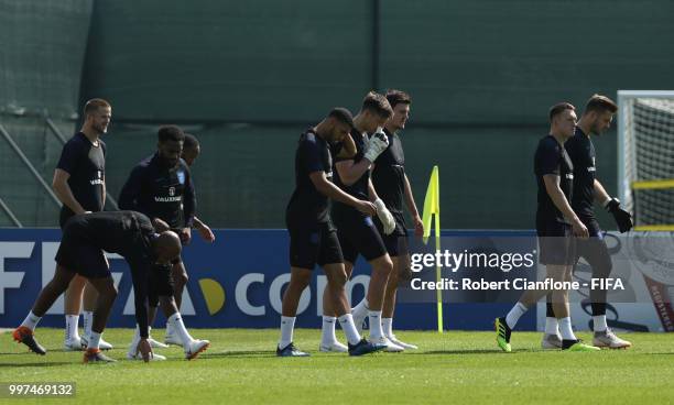 Players walk to the pitch with team mates during an England training session during the 2018 FIFA World Cup Russia at Spartak Zelenogorsk Stadium on...