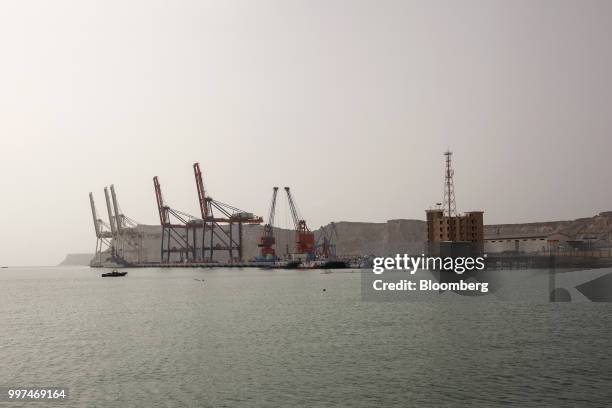 Gantry cranes stand at Gwadar Port, operated by China Overseas Ports Holding Co., in Gwadar, Balochistan, Pakistan, on Tuesday, July 4, 2018. What...