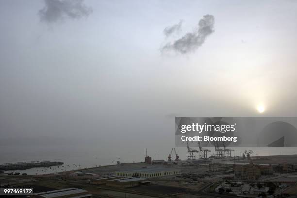 The sun rises over Gwadar Port, operated by China Overseas Ports Holding Co., in Gwadar, Balochistan, Pakistan, on Tuesday, July 4, 2018. What used...