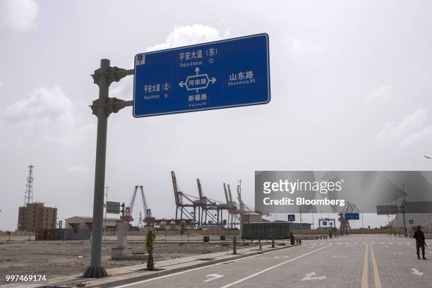 Road sign stands at the Gwadar Free Zone, operated by China Overseas Ports Holding Co., in Gwadar, Balochistan, Pakistan, on Tuesday, July 4, 2018....