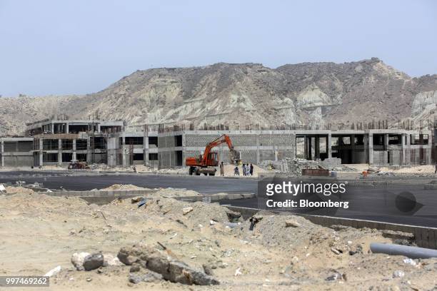 Buildings stand under construction at a development site, operated by China Overseas Ports Holding Co., near Gwadar Port in Gwadar, Balochistan,...