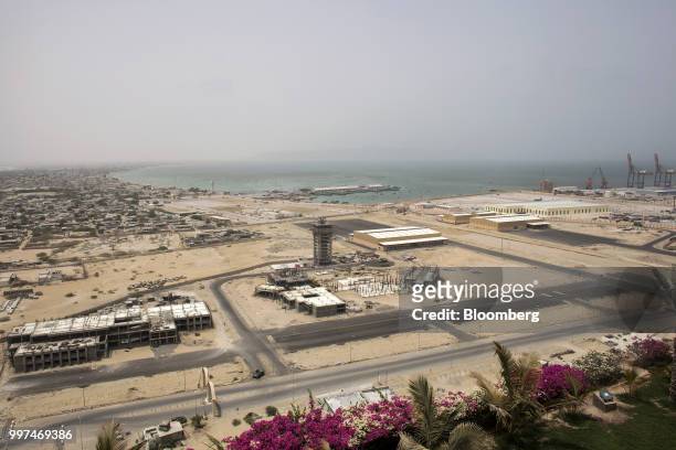 Equipment and materials sit at a developemt site near Gwadar Port, operated by China Overseas Ports Holding Co., in Gwadar, Balochistan, Pakistan, on...