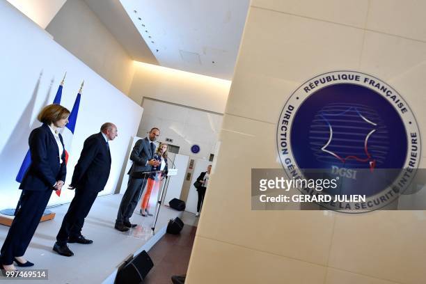French Prime Minister Edouard Philippe flanked by French Minister of the Interior Gerard Collomb and French Defence Minister Florence Parly speaks...
