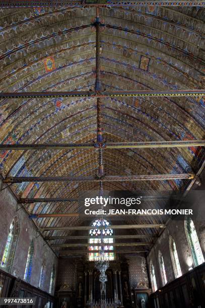 This photo taken on June 22 in Illiers-Combray, shows the painted wooden vault of the Saint Jacques church which overhangs the closed benches. - The...