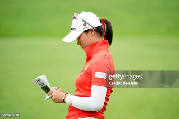 Budsabakorn Sukapan of Thailand checks her yardage book during the final round of the ANA Princess Cup on July 13, 2018 in Abira, Hokkaido, Japan.