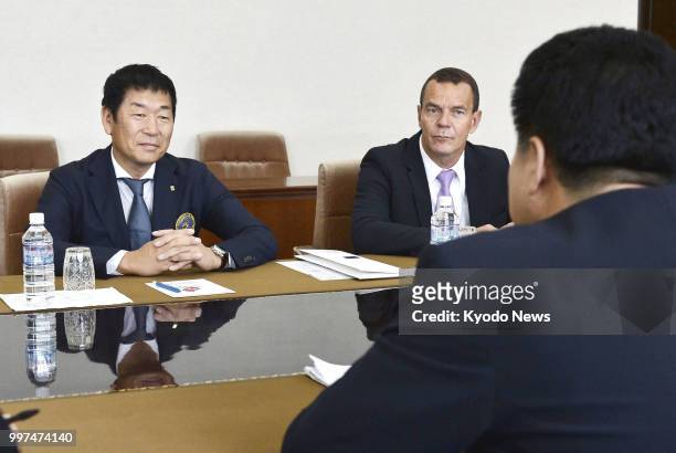 International Gymnastics Federation President Morinari Watanabe and North Korean Sports Minister Kim Il Guk who doubles as the president of his...