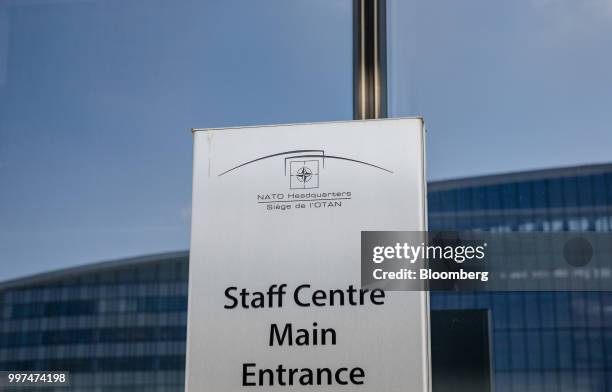 Sign stands at an entrance during the North Atlantic Treaty Organization summit at the military and political alliance's headquarters in Brussels,...