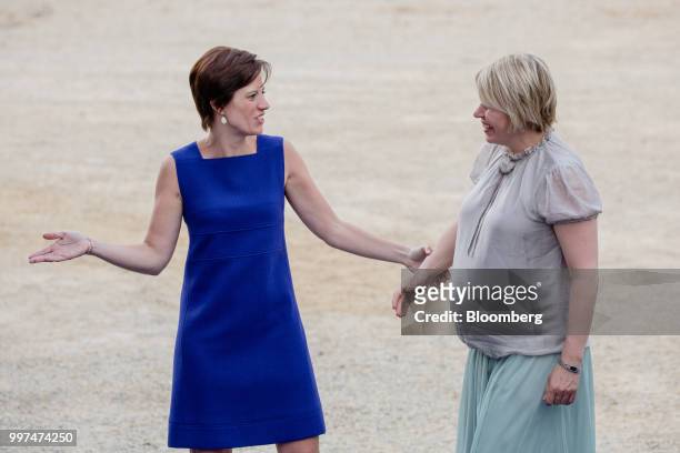 Amelie Derbaudrenghien, partner of Belgiums Prime Minister Charles Michel, left, welcomes Karin Ratas, wife of Estonias Prime Minister Juri Ratas, as...