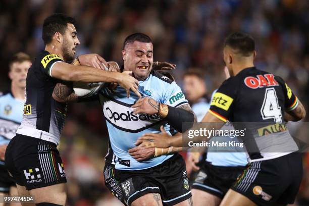 Andrew Fifita of the Sharks is tackled during the round 18 NRL match between the Panthers and the Sharks at Panthers Stadium on July 13, 2018 in...