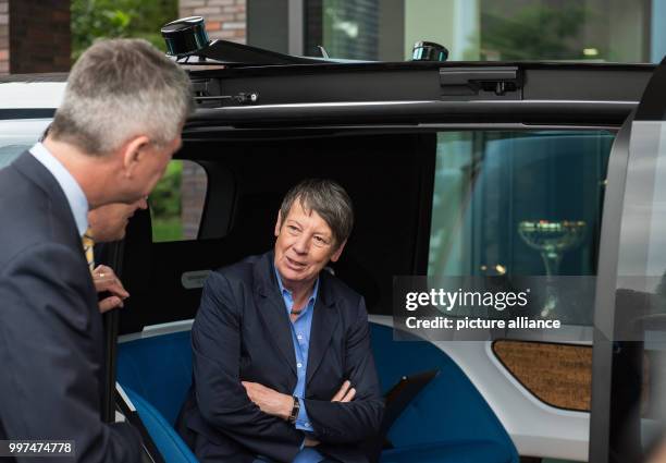 Matthias Müller, the CEO of Volkswagen AG, and German environment minister Barbara Hendricks outside the Volkswagen factory in Wolfsburg, Germany, 27...