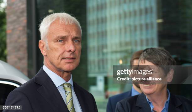 Matthias Müller, the CEO of Volkswagen AG, and German environment minister Barbara Hendricks outside the Volkswagen factory in Wolfsburg, Germany, 27...