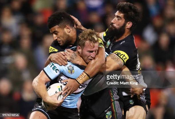 Matt Prior of the Sharks is tackled during the round 18 NRL match between the Panthers and the Sharks at Panthers Stadium on July 13, 2018 in...