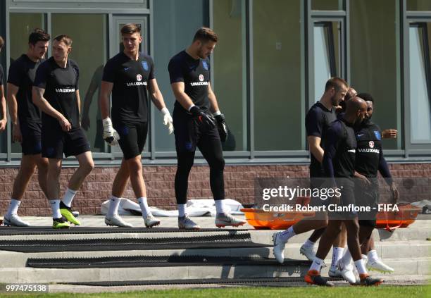 Goalkeepers Nick Pope and Jack Butland of England walk to the pitch with team mates during an England training session during the 2018 FIFA World Cup...