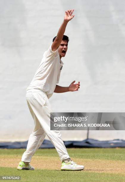 Indian under-19 cricketer Arjun Tendulkar, son of the Indian former cricket superstar Sachin Tendulkar, appeals a decision during a warm-up match...