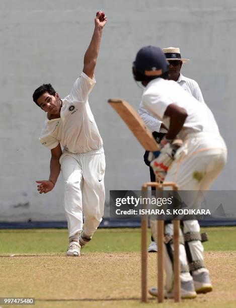 Indian under-19 cricketer Arjun Tendulkar , son of the Indian former cricket superstar Sachin Tendulkar, bowls during a warm-up match between the...