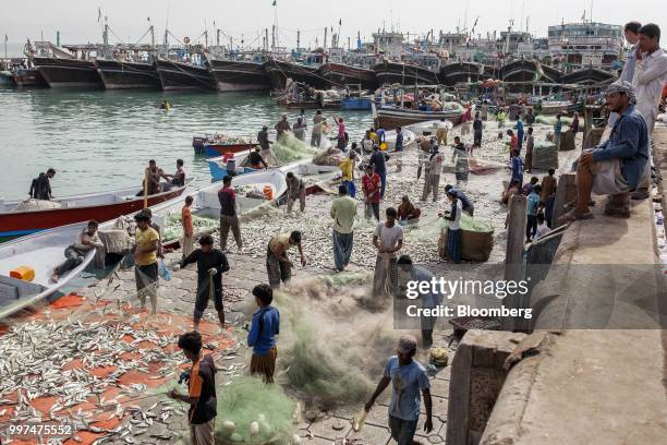 Fishermen sort their catches at the harbor in Gwadar, Balochistan, Pakistan, on Tuesday, July 4, 2018. What used to be a small fishing town on the...