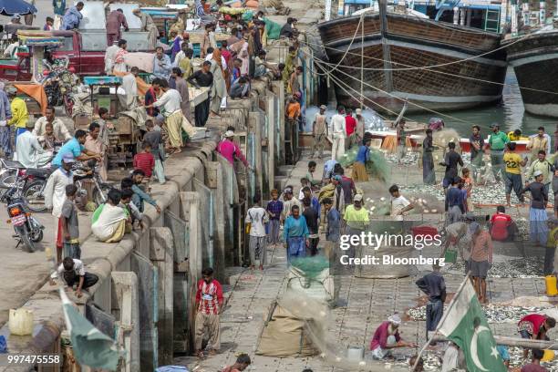 Fishermen sort their catches at the harbor in Gwadar, Balochistan, Pakistan, on Tuesday, July 4, 2018. What used to be a small fishing town on the...