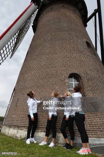 Germany's Lina Magull, Leonie Maier, Mandy Islacker and Sara Däbritz by a windmill in Den Dungen, the Netherlands, 27 July 2017. Photo: Carmen...