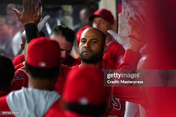 Albert Pujols of the Los Angeles Angels of Anaheim celebrates during the MLB game against the Seattle Mariners at Angel Stadium on July 12, 2018 in...