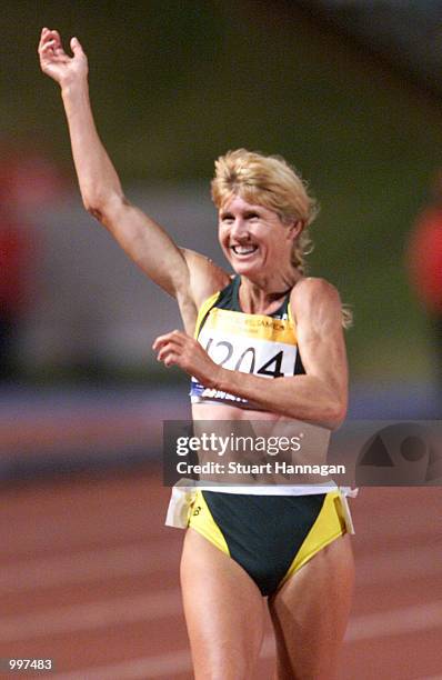 Kerry Saxby-Junna of Australia waves to the crowd after possibly her last race in the Womens 20000 Metres Track Walk during the athletics at the ANZ...