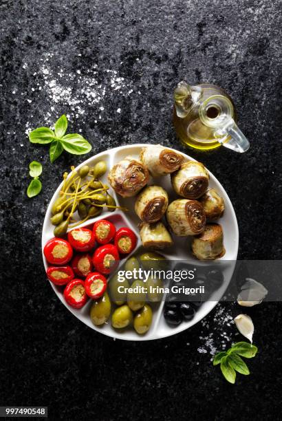 starter of green olives, black olives, capers, buffalo mozzarell - starter stock-fotos und bilder