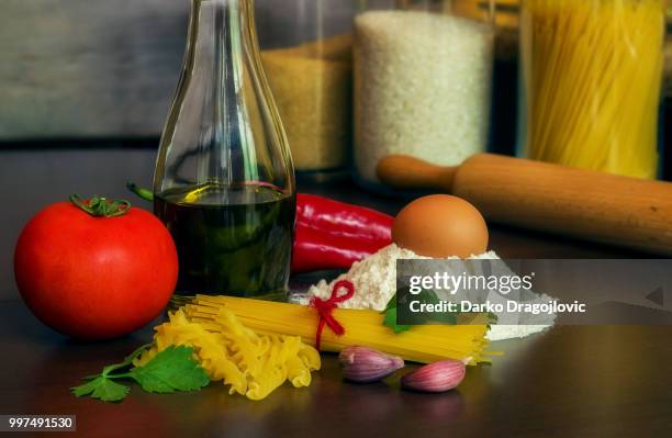 pasta with tomato and garlic - tomato pasta stock pictures, royalty-free photos & images