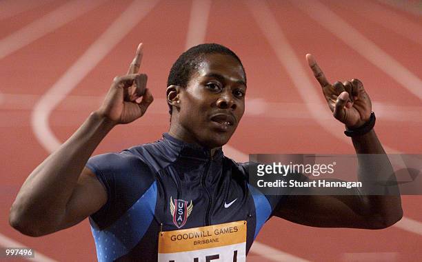 Shawn Crawford of the USA celebrates victory in the Mens 200 Metres with a time of 20.17 seconds during the athletics at the ANZ Stadium during the...