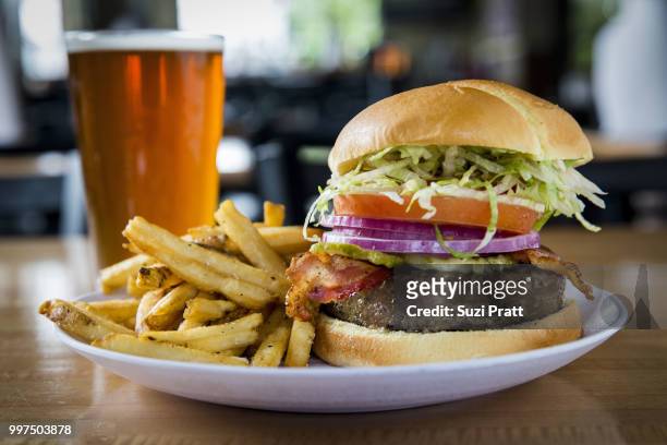 burger and a beer - suzi pratt stock pictures, royalty-free photos & images