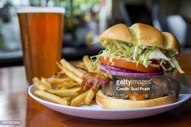 burger and a beer - suzi pratt stock pictures, royalty-free photos & images