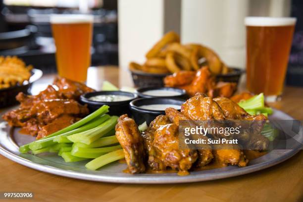 hot wings and beer - suzi pratt stock pictures, royalty-free photos & images