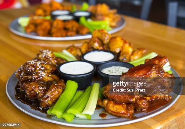 hot wings - suzi pratt stock pictures, royalty-free photos & images
