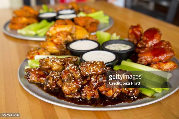 hot wings - suzi pratt stock pictures, royalty-free photos & images