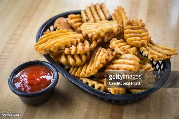 waffle fries - suzi pratt stock pictures, royalty-free photos & images