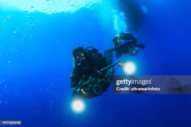 underwater, underwater photographer technical diving scuba diver exploring and enjoying sea life water sports techdive scuba diver point of view - scuba diver point of view stock pictures, royalty-free photos & images