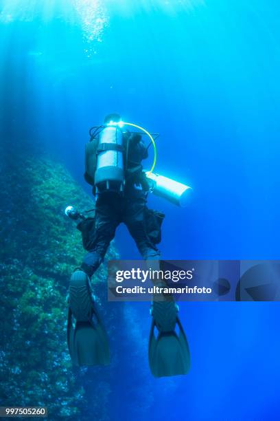 underwater, underwater photographer technical diving scuba diver exploring and enjoying sea life water sports techdive scuba diver point of view - scuba diver point of view stock pictures, royalty-free photos & images