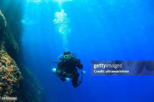 underwater, underwater photographer technical diving scuba diver exploring and enjoying sea life water sports techdive scuba diver point of view - scuba diver point of view stock pictures, royalty-free photos & images