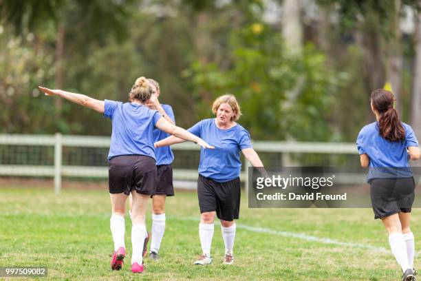 happy winning womens soccer players celebrating - freund stock pictures, royalty-free photos & images