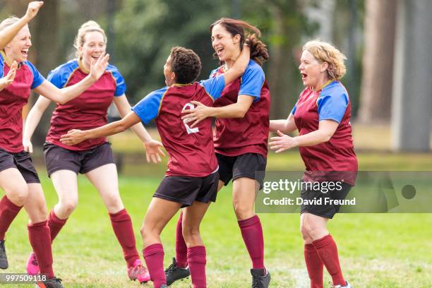 happy winning womens soccer players celebrating - david freund stock pictures, royalty-free photos & images