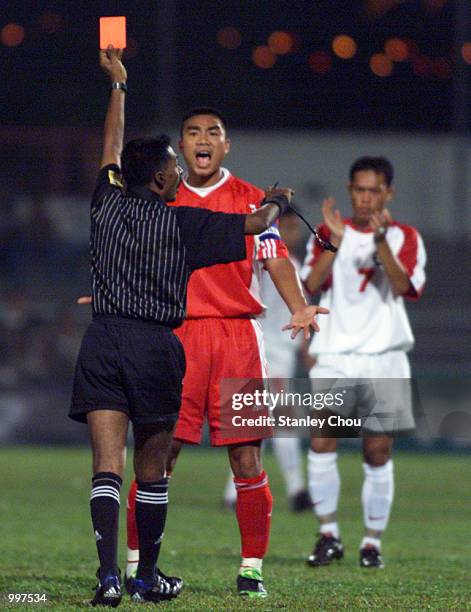 Nguyen Quoc Trung of Vietnam is sent off by the Referee in a Group B match held at the MPPJ Stadium, Petaling Jaya, Malaysia during the Under-23 Men...