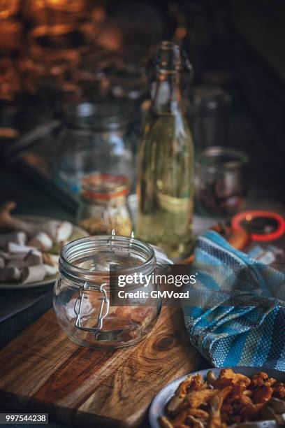 preserving organic mushrooms in jars - preserved in oil stock pictures, royalty-free photos & images