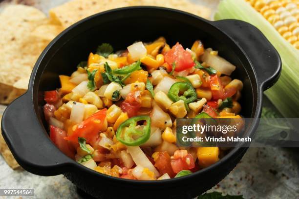 grilled corn mango salsa, selective focus - mango salsa stock pictures, royalty-free photos & images