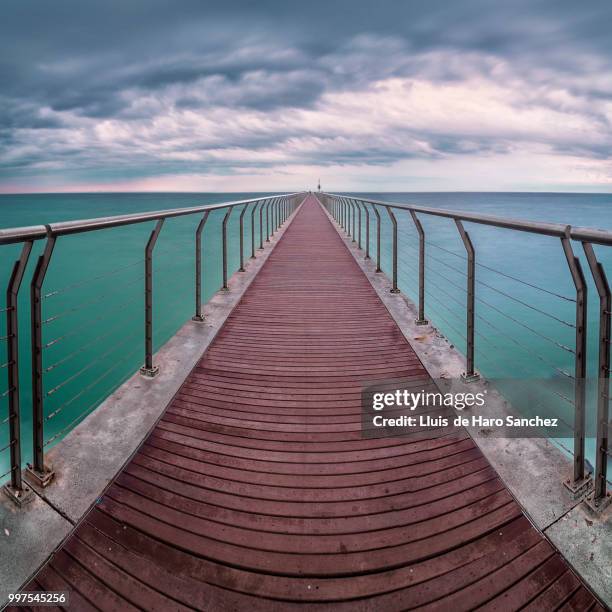 walking on the sea - badalona stock pictures, royalty-free photos & images